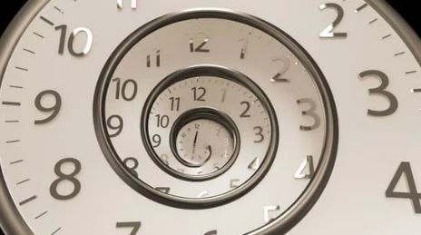 Clock spiraling backwards to represent passing time